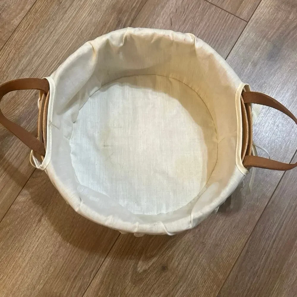Longaberger Round Basket 10”with leather handles lace trim liner 1990 signed.